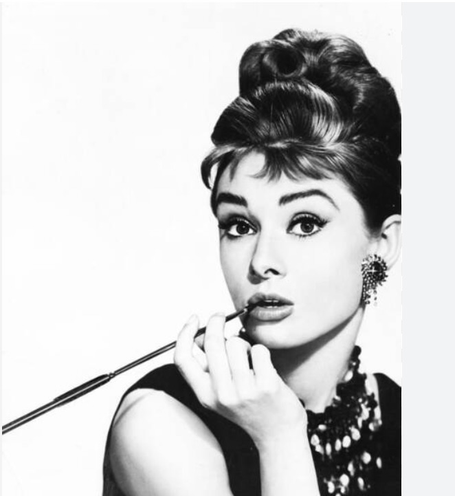 Leslie Goddard as Audrey Hepburn